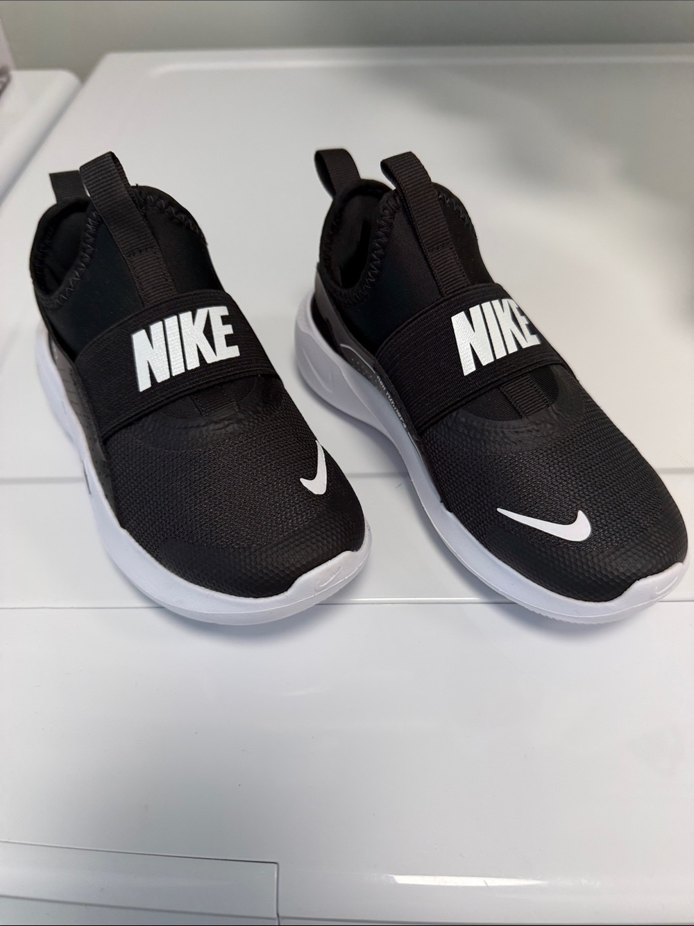 Nike Kids Black Slip-On Sneakers with White Swoosh Band. Brand new - NO BOX